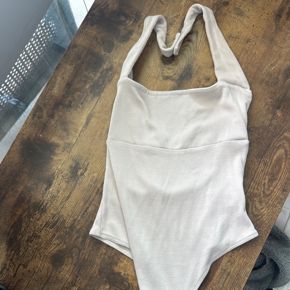 Cream Bodysuit with Halter Neckline and Ribbed Fabric